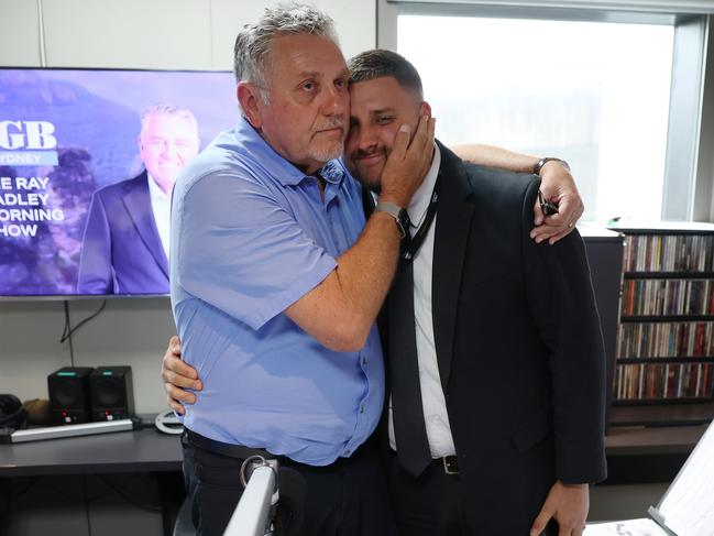 Ray embraced his son Daniel Hadley in the studio after the announcement. Picture: Rohan Kelly.