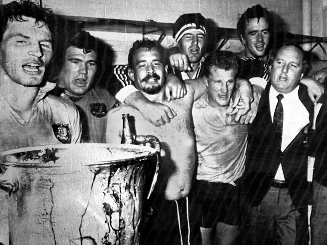 Australian coach Alan Jones celebrates with Wallabies (l-r) Simon Poidiven, Tom Lawton, Enrique Rodriguez, Ross Reynolds, Michael Lynagh and Steve Cutler after their Bledisloe Cup win over New Zealand in Auckland in 1986.