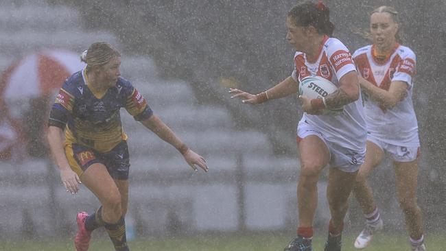 WOLLONGONG, AUSTRALIA - MARCH 06: Madison Bartlett of the Dragons runs with the ball as torrential rain hits Ã¢â&#130;¬â&#128;¹during the round two NRLW match between the St George Illawarra Dragons and the Parramatta Eels at WIN Stadium, on March 06, 2022, in Wollongong, Australia. (Photo by Mark Evans/Getty Images