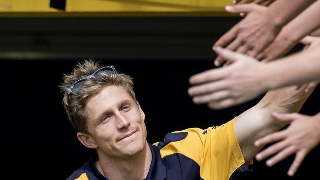 Scott Selwood of the West Coast Eagles high fives fans during an Eagles Welcome Home function at Domain Stadium, Subiaco on 4 October 2015