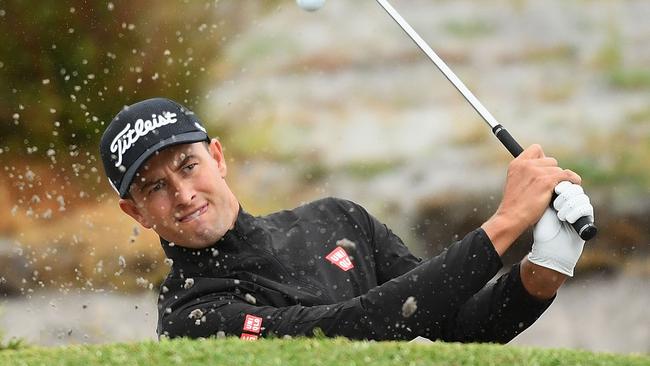 Adam Scott of Australia plays out of the bunker.