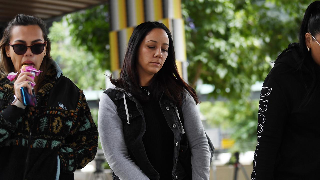 Cindy Palmer (centre), the biological mother of murdered 12-year-old schoolgirl Tiahleigh Palmer, is seen outside the Coroners Court in Brisbane. Picture: Dan Peled