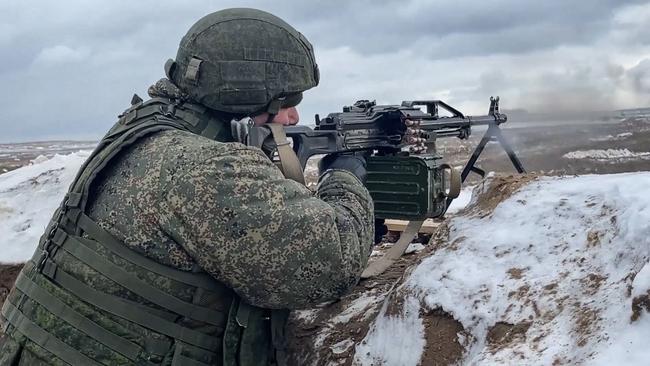 A soldier opens fire with a machinegun during a joint exercise this week between Russian and Belarusian troops in Belarus. Picture: AFP