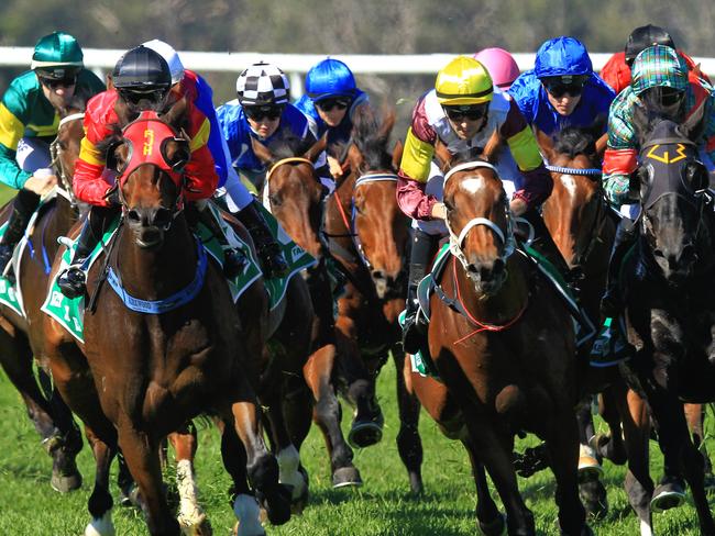 Loving home ridden by Tye Angland  (yellow cap, maroon with yellow armbands) wins race 1 during Scone  Races located in the Upper Hunter Region of NSW. The Bend . Pic Jenny Evans