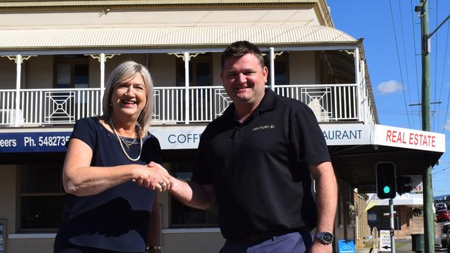 ‘DEAL FROM HEAVEN’: Marg Cochrane of Gympie Regional Realty outside the firm’s Mary St headquarters, with new owner of Billy Mitchell, of Century 21.