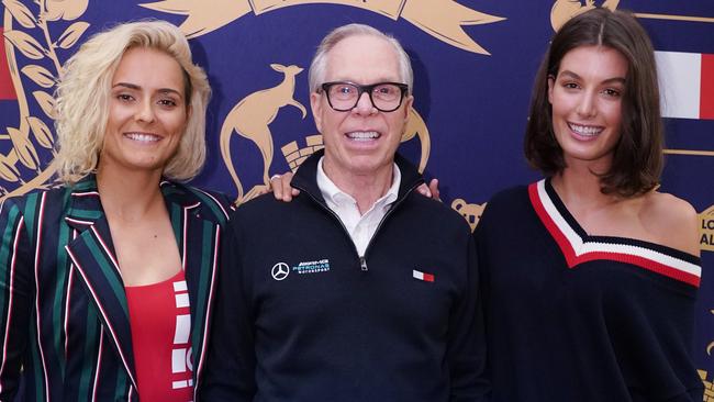 Hope - pictured with designer Tommy Hilfiger in Melbourne on Friday along with her wife, Isabella. Picture: AAP