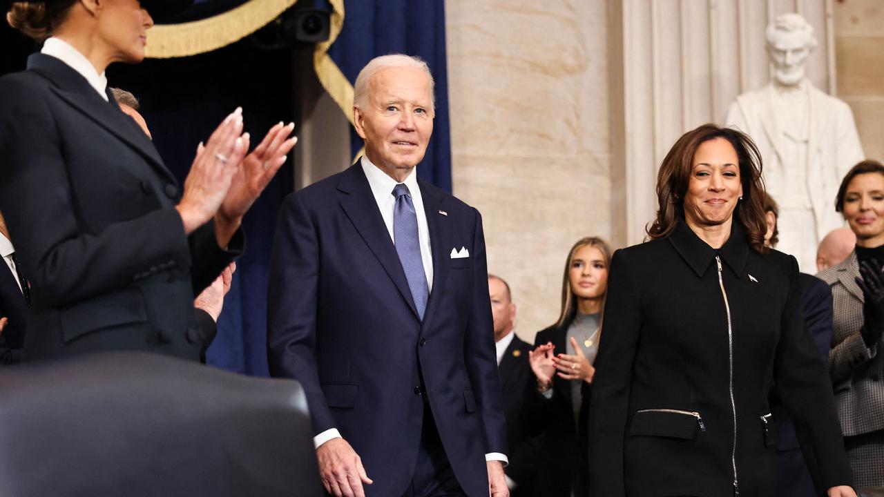 US President Joe Biden and US Vice President Kamala Harris arrive to attend the inauguration of US President-elect Donald Trump in the Rotunda of the US Capitol.