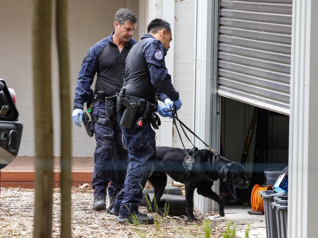 The dogs found several iPads, SD cards and USB sticks were found at the home where the lunch was held. Picture: Ian Currie