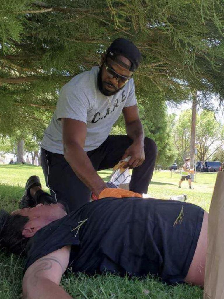 Jon Jones shared this photo of him taking care of a dehydrated man.