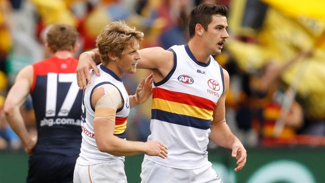 Rory Sloane and Taylor Walker celebrate an Adelaide goal.