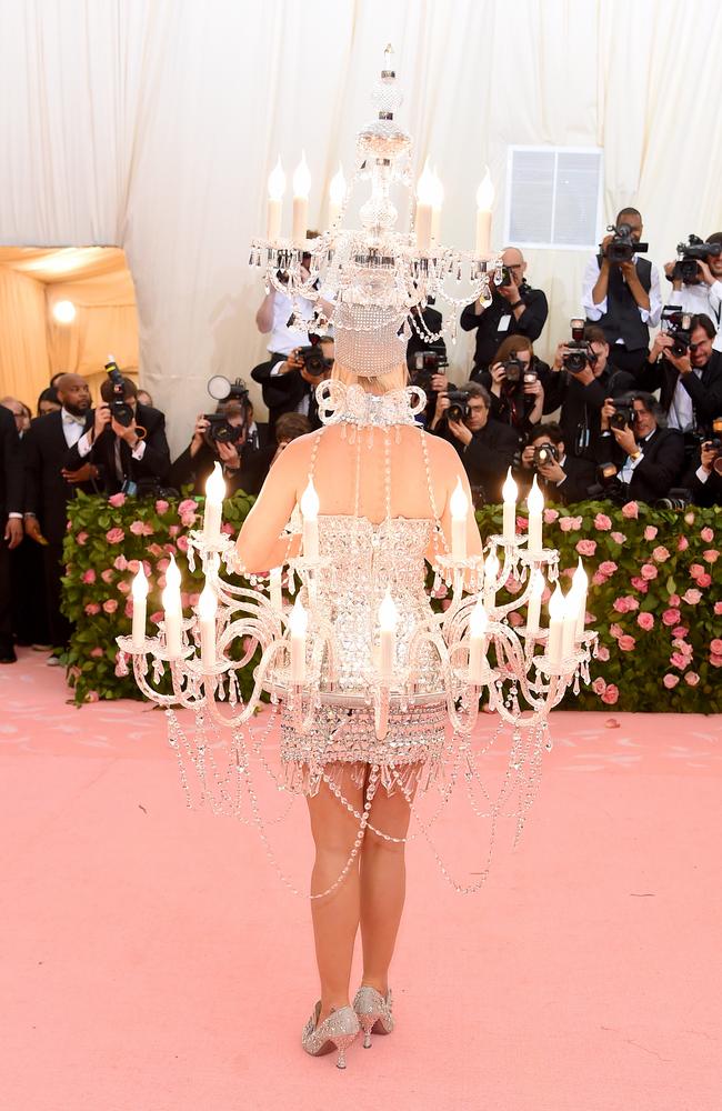 Not made for sitting, the bejeweled dress was designed by Moschino. Picture: Getty Images