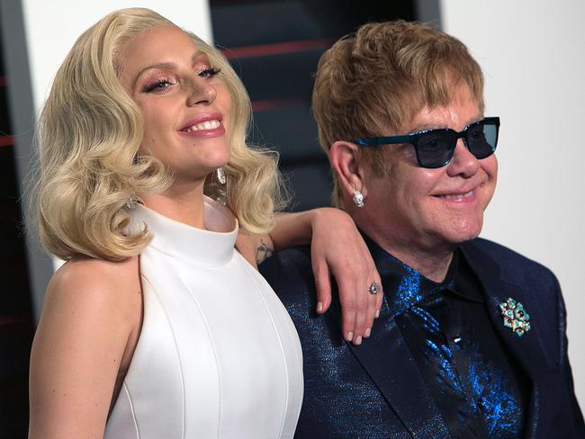 Lady Gaga and Sir Elton John arrived together for the Vanity Fair post Oscars party. Picture: AFP/ADRIAN SANCHEZ-GONZALEZ