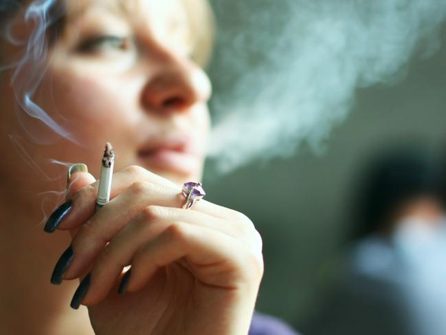 young woman smoking cigarette