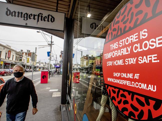 MELBOURNE, AUSTRALIA - NewsWire Photos October 6 2020: A man walks past a closed fashion retail store in Sydney rd Brunswick on Tuesday afternoon in Melbourne before the handing down of the Federal Budget. Picture: NCA NewsWire / David Geraghty