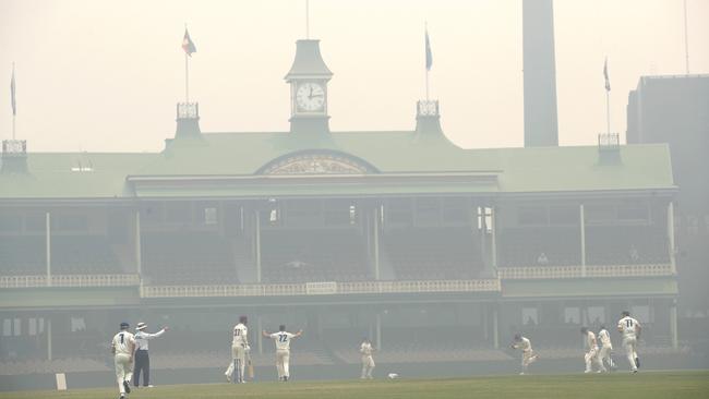 Smoke from the NSW bushfires blanketed the SCG during a Sheffield Shield match between NSW and Queensland recently. Picture: Phil Hillyard