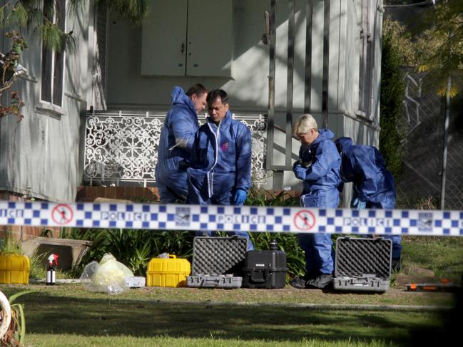 Forensic police look for clues outside the house where a Hayley’s nan and cousin were killed.