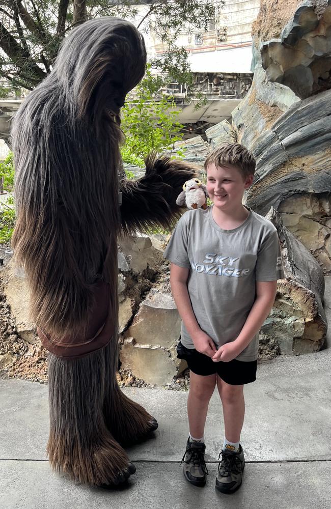 Brisbane resident Jonah O'Brien, 11, with famed Wookie, Chewbacca, at the Star Wars: Galaxy Edge section of Walt Disney World's Hollywood Studios in Orlando, Florida in the US. Picture: Jodie O'Brien