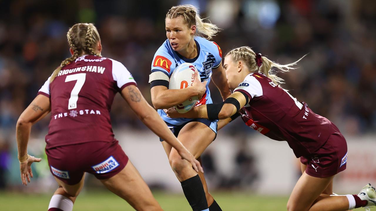 Emma Tonegato busts a tackle.