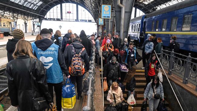 Evacuees from Zaporizhzhia region walk on a platform after arriving by an evacuation train at the railway station of the western Ukrainian city of Lviv. Picture: AFP