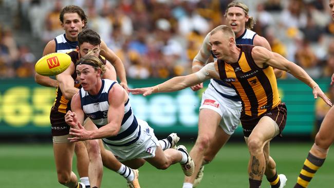 Tanner Bruhn shoots out a handball. Picture: Quinn Rooney/Getty Images