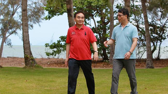 Benny Wu, left, of Fortune Island Holding Company, touring Double Island, off Palm Cove, Cairns, in 2012, with Davey Tam, after the company took over the lease. Picture: Tom Lee