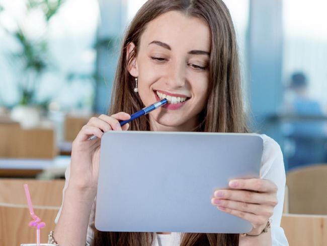 Generic photo of a teenage girl using a digital tablet