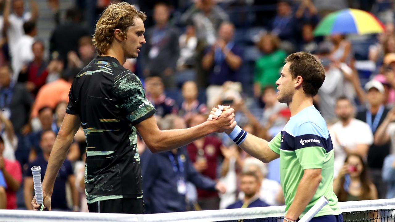 Alexander Zverev towers over Diego Schwartzman after the match at Flushing Meadows.