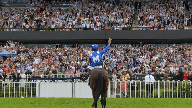 Jockey Hugh Bowman salutes the crowd after Winx’s victory in the George Ryder Stakes. Picture: AAP