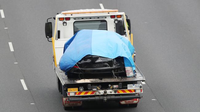 The Porsche is removed from the scene. Picture: David Crosling