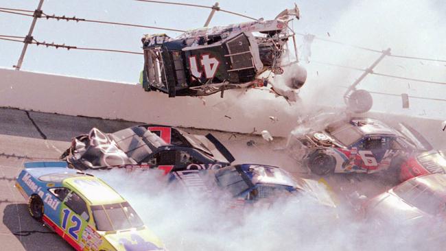 NASCAR driver Ricky Craven (41) of Newburgh, Maine, flips into the catchfence in a spectacular crash at the Talladega Superspeedway in 1996. Picture: AP