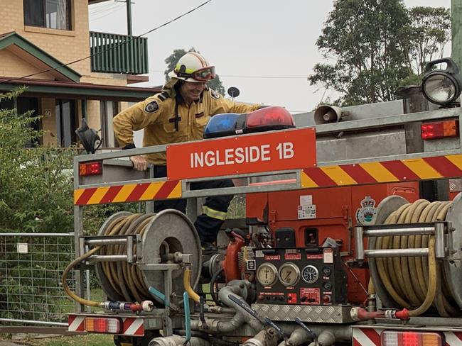 Former prime minister Tony Abbott climbs aboard a Rural Fire Service tanker at Milton to make sure its filling with water. Picture: Sarah Lawson