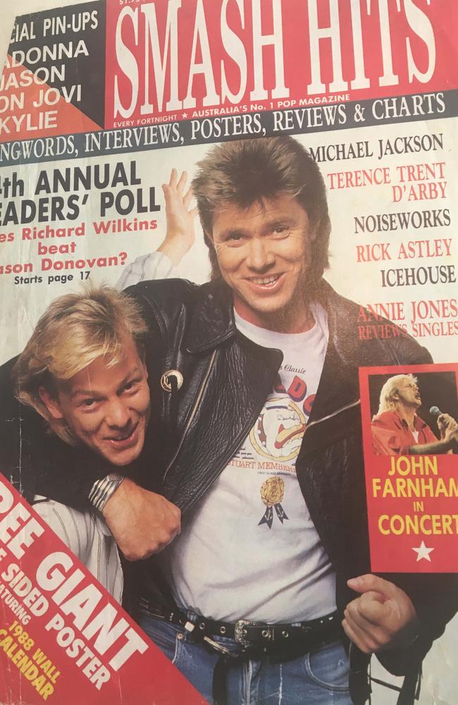 Dickie engages Jason Donovan in a wrestle on a magazine cover in the late 80s.