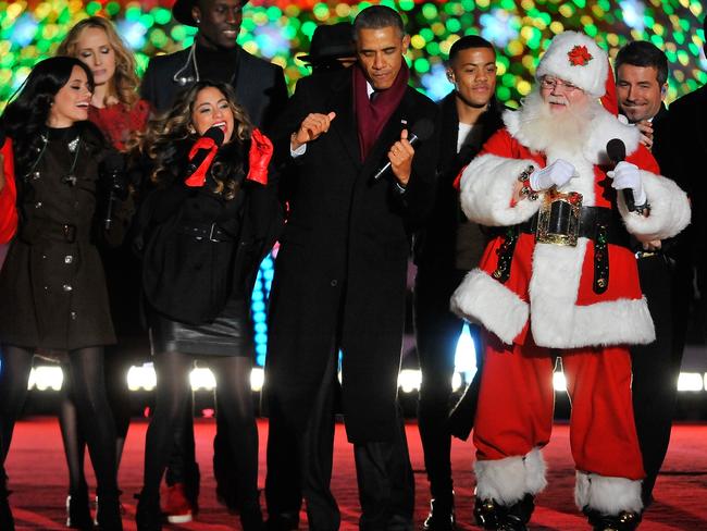 President Barack Obama joins the festivities on stage to end the National Christmas Tree at the National Park Foundation and Google’s “Made with Code” National Christmas Tree Lightening Ceremony on December 4, 2014 in Washington, DC. Picture: Larry French/Getty Images for Google