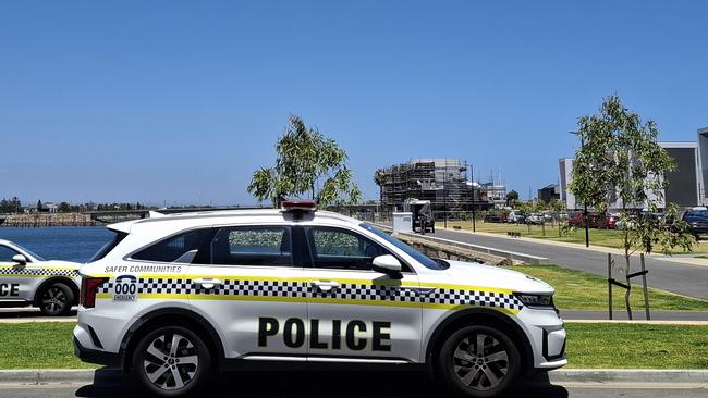 About five SA Police officers including members of the Water Operations Unit, remained at scene where a body was discovered at New Port on Tuesday afternoon.