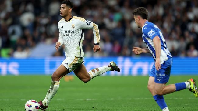 MADRID, SPAIN - MAY 14: Jude Bellingham of Real Madrid runs with the ball during the LaLiga EA Sports match between Real Madrid CF and Deportivo Alaves at Estadio Santiago Bernabeu on May 14, 2024 in Madrid, Spain. (Photo by Clive Brunskill/Getty Images)