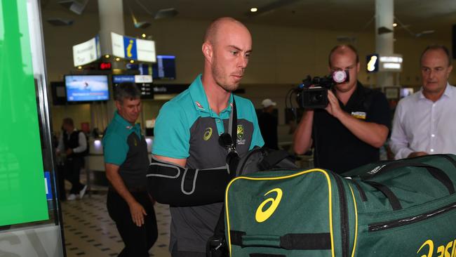 Australian cricketer Chris Lynn with his arm in a sling as he arrives back home following Wednesday’s T20 final.