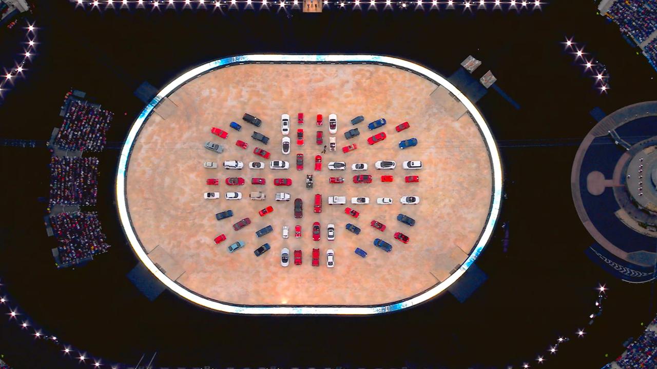 Cars come together to create the flag of Great Britain during the Opening Ceremony