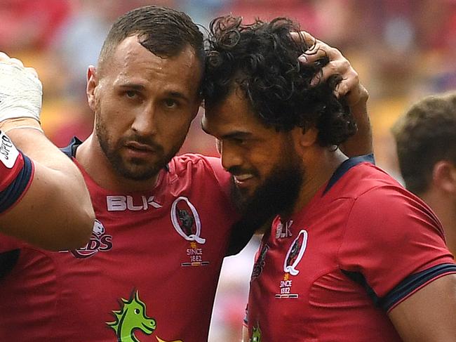 Karmichael Hunt of the Queensland Reds (right) is congratulated by teammate Quade Cooper after scoring try during their round 8 Super Rugby game against the Southern Kings at Suncorp Stadium in Brisbane, Saturday, April 15, 2017. (AAP Image/Dan Peled) NO ARCHIVING, EDITORIAL USE ONLY