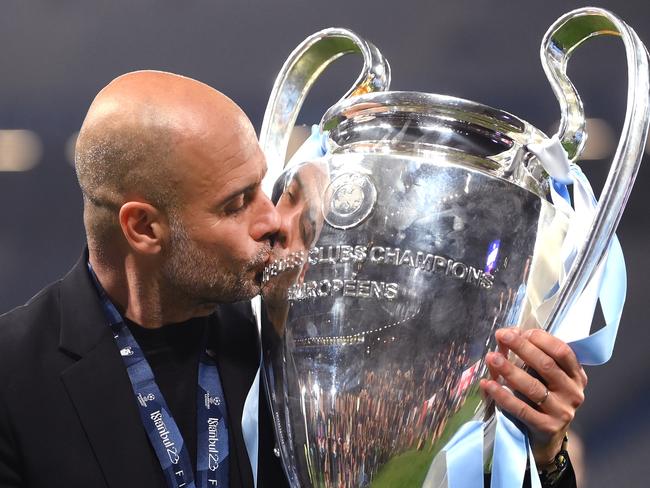 Pep Guardiola kisses the Champions League trophy after a lengthy separation. Picture: Shaun Botterill/Getty Images