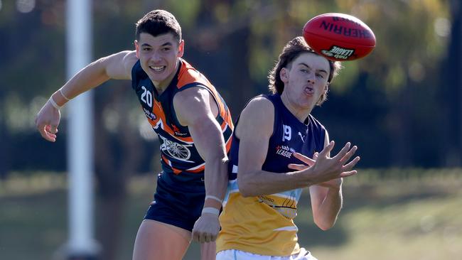 Ben Morgan spoils Jason Gillbee’s marking attempt.