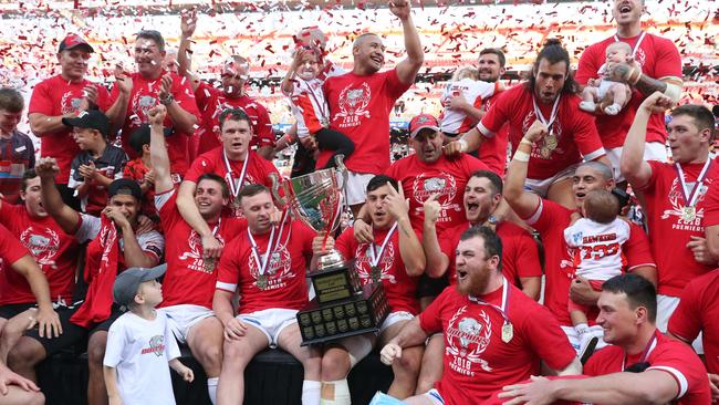 Broncos stars Jake Turpin and Kotoni Staggs (with trophy) celebrate Redcliffe’s 2018 Intrust Cup Grand Final win. Picture: Peter Wallis