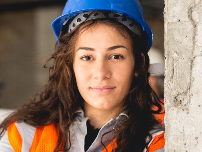 Construction workers smiling at construction site