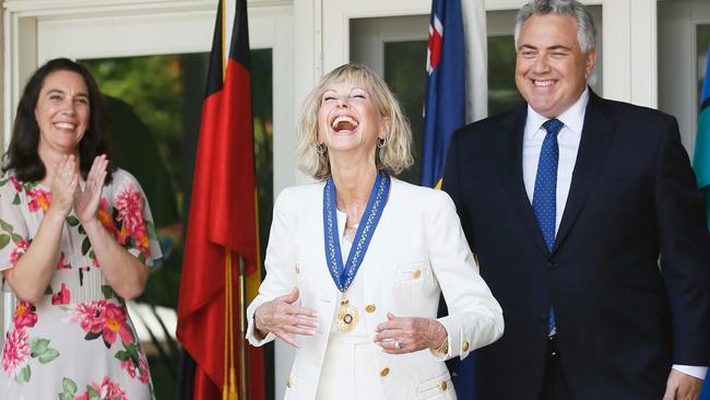 Joe Hockey presents Olivia Newton-John with her Companion of the Order of Australia award last month. Picture: Danny Moloshok