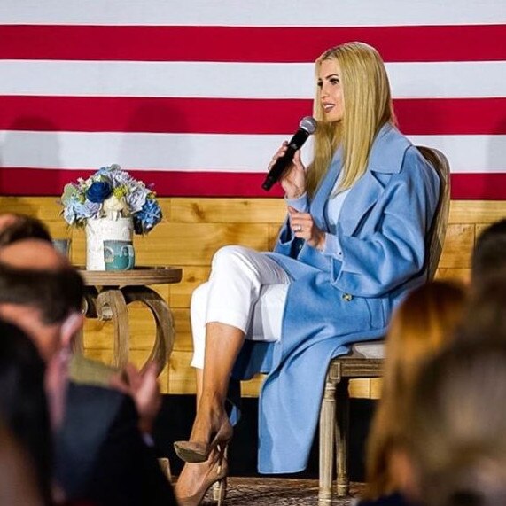 Ivanka in an oversize blue trench coat and capri pants in North Carolina.