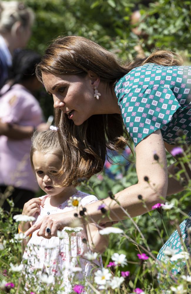 The shy young girl didn’t let go of Kate’s hand. Picture: Heathcliff O'Malley — WPA Pool/Getty Images