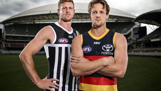 Grudge match: Port Adelaide’s Tom Jonas and Adelaide Crows’ Rory Sloane. More than 2000 people will be allowed to watch their teams meet this weekend. Picture: Sarah Reed