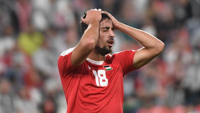 Palestine's midfielder Oday Dabbagh reacts after a missed shot during the 2019 AFC Asian Cup group B football match between Palestine and Jordan at the Mohammed Bin Zayed Stadium in Abu Dhabi on January 15, 2019. (Photo by Khaled DESOUKI / AFP)