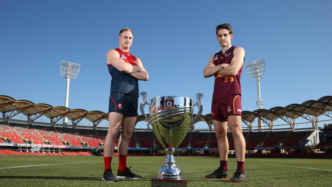 The captains of Surfers Paradise Demons and Palm Beach Currumbin ,Brody Haberfield and Stephen Thynne, with the QAFL cup at Metricon Stadium. Picture Glenn Hampson