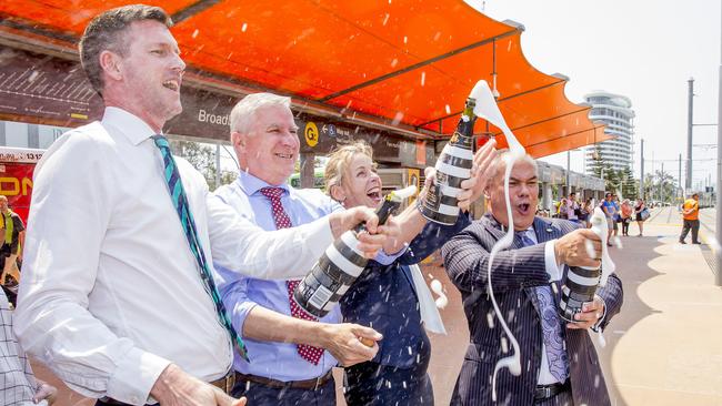 Transport Minister Mark Bailey, Depty Prime Minister of Australia, Michael McCormack, Angie Bell MP and Gold Coast Mayor Tom Tate, popping Champagne. Picture: Jerad Williams