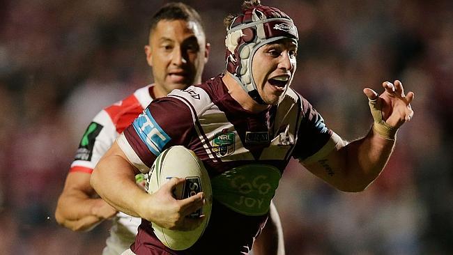 Jamie Buhrer evades the tackle of Benji Marshall of the Dragons to score a try at Brookvale Oval. Picture: Getty Images.